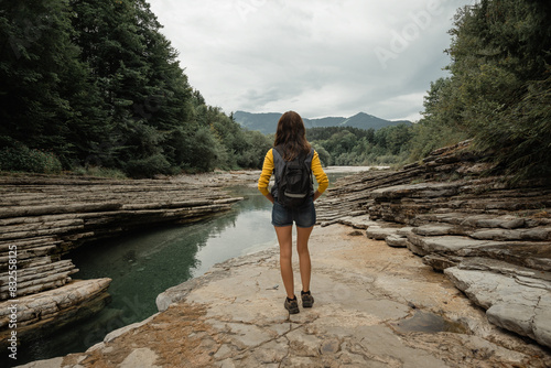 Woman hiking along the Taugl river in Tennengau, Austria. photo