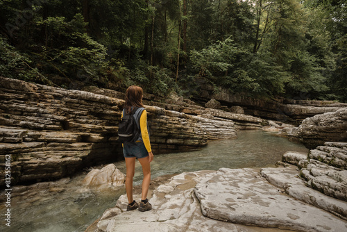 Woman hiking along the Taugl river in Tennengau  Austria.