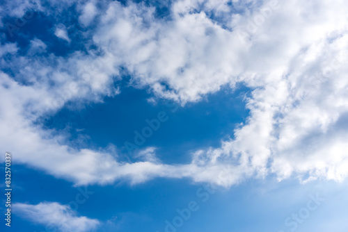 White fluffy clouds in front of a blue sky