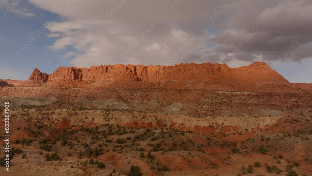 Aerial Scenic Shot Of Sand Rock Formation Under Clouds, Drone Flying Forward Over Semi Arid Desert Landscape - Moab, Utah Aerial Scenic Shot Of Sand Rock Formation Under Clouds, Drone Flying Forward Over Semi Arid Desert Landscape - Moab, Utah