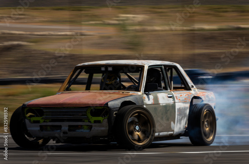 fast drift car drifting with smoke smokey tires on asphalt, speeding car vehicle driving