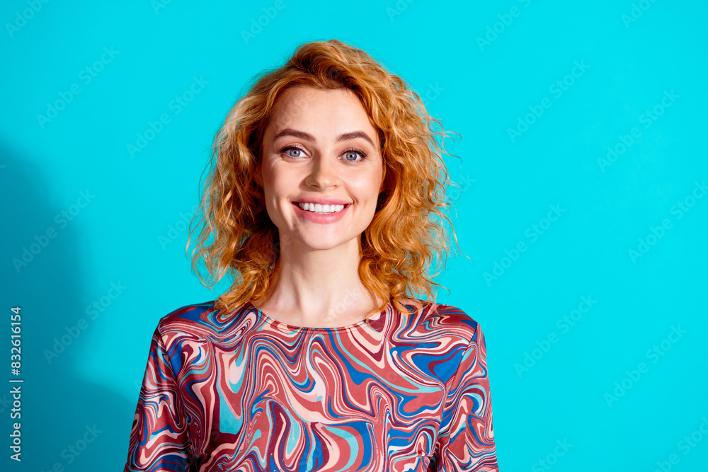 Photo of pretty woman beaming smile empty space wear t-shirt isolated on teal color background Photo of pretty woman beaming smile empty space wear t-shirt isolated on teal color background