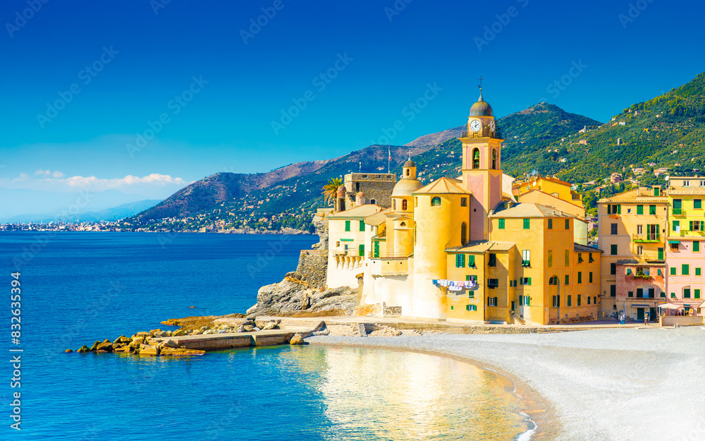 Scenic Mediterranean riviera coast. Panoramic view of Camogli town in Liguria, Italy. Basilica of Santa Maria Assunta and colorful palaces. Liguria, Italy