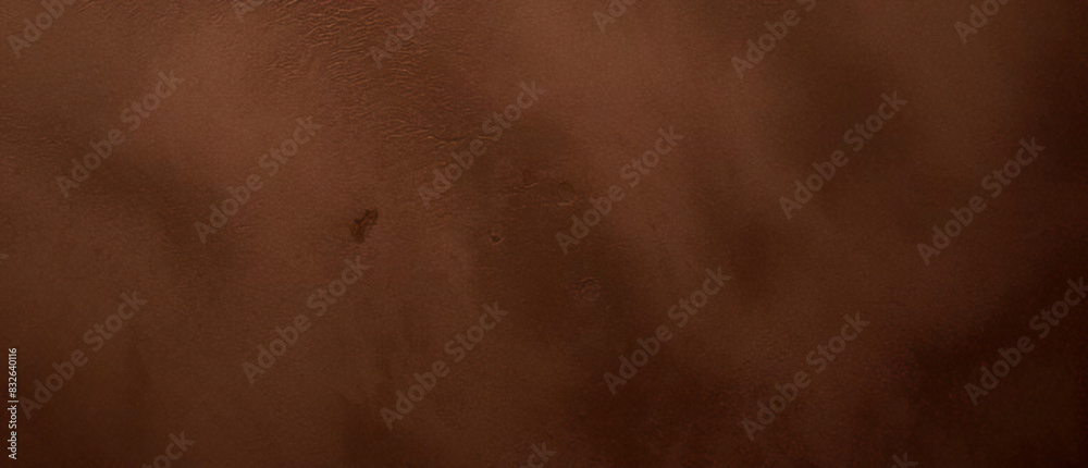 Close-up texture of reddish-brown surface with rugged and cracked patterns Close-up texture of reddish-brown surface with rugged and cracked patterns