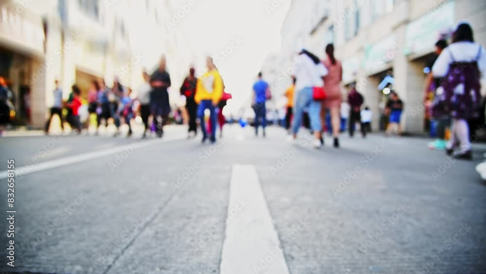 Defocused crowd of people walking on the street Defocused crowd of people walking on the street