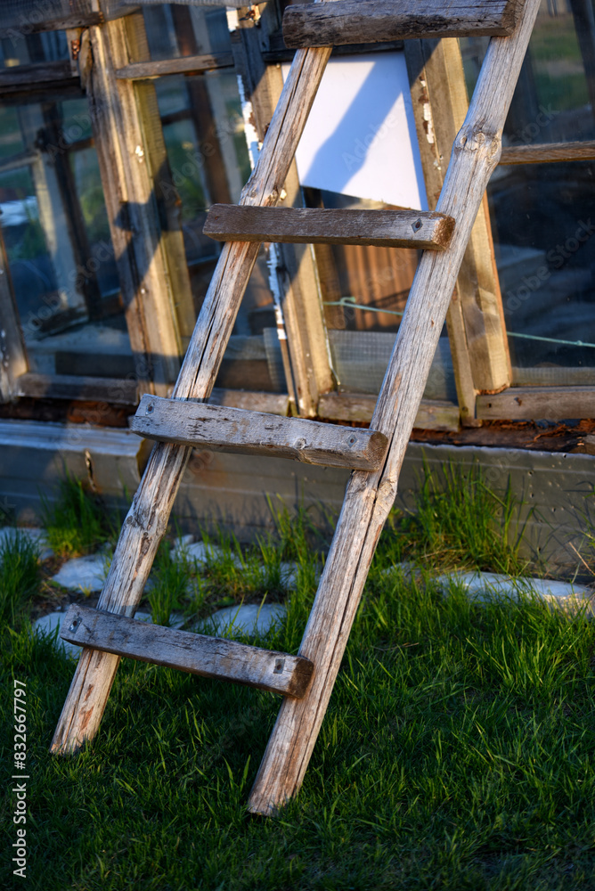 An old wooden staircase tilted onto the barn. Wooden stairs in the village. An old wooden staircase tilted onto the barn. Wooden stairs in the village.