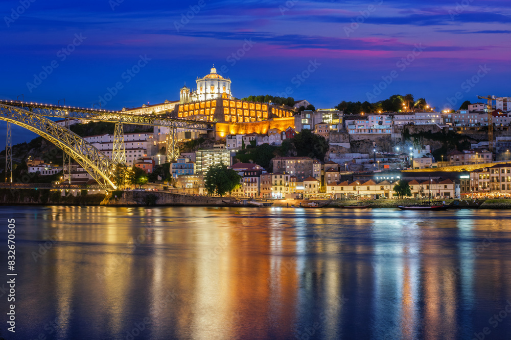View of Vila Nova de Gaia city with Mosteiro da Serra do Pilar monastery and Dom Luis I bridge over Douro river in evening twilight. Porto, Vila Nova de Gaia, Portugal View of Vila Nova de Gaia city with Mosteiro da Serra do Pilar monastery and Dom Luis I bridge over Douro river in evening twilight. Porto, Vila Nova de Gaia, Portugal