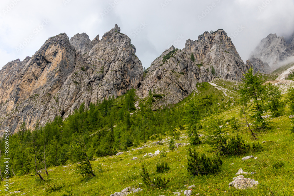 Dolomites beautiful mountain landscape on a sunny day. Hiking in the Alps in Italy, South Tirol mountain range of Alpi Dolomiti di Sesto near Cortina di Amprezzo and Tre Cime di Lavaredo alpine scene Dolomites beautiful mountain landscape on a sunny day. Hiking in the Alps in Italy, South Tirol mountain range of Alpi Dolomiti di Sesto near Cortina di Amprezzo and Tre Cime di Lavaredo alpine scene