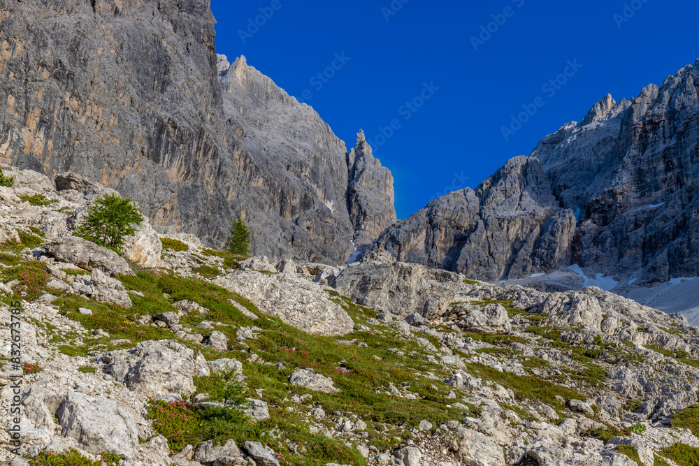 Dolomites beautiful mountain landscape on a sunny day. Hiking in the Alps in Italy, South Tirol mountain range of Alpi Dolomiti di Sesto near Cortina di Amprezzo and Tre Cime di Lavaredo alpine scene