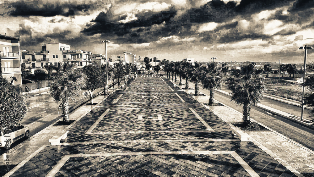 Obraz premium Aerial view of city promenade along the ocean, beautiful coast at sunset from drone.