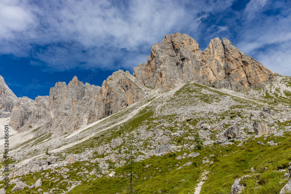 Dolomites beautiful mountain landscape on a sunny day. Hiking in the Alps in Italy, South Tirol mountain range of Alpi Dolomiti di Sesto near Cortina di Amprezzo and Tre Cime di Lavaredo alpine scene Dolomites beautiful mountain landscape on a sunny day. Hiking in the Alps in Italy, South Tirol mountain range of Alpi Dolomiti di Sesto near Cortina di Amprezzo and Tre Cime di Lavaredo alpine scene