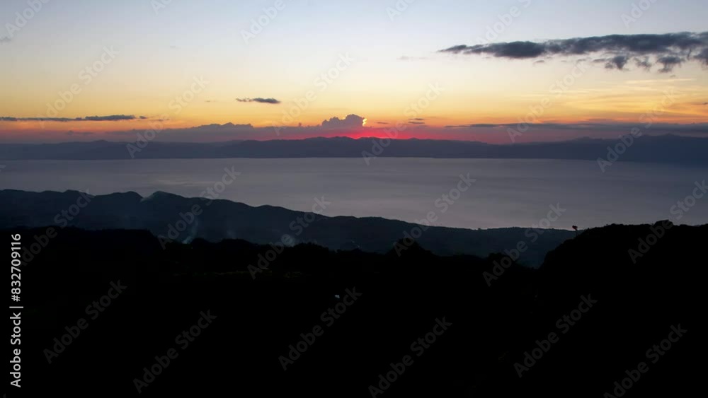 4K Aerial Drone video of a mesmerizing sunset over the beautiful Casino Peak with the view of the coastline and surrounding mountain range and a flag on the wind, Cebu, Philippines 4K Aerial Drone video of a mesmerizing sunset over the beautiful Casino Peak with the view of the coastline and surrounding mountain range and a flag on the wind, Cebu, Philippines