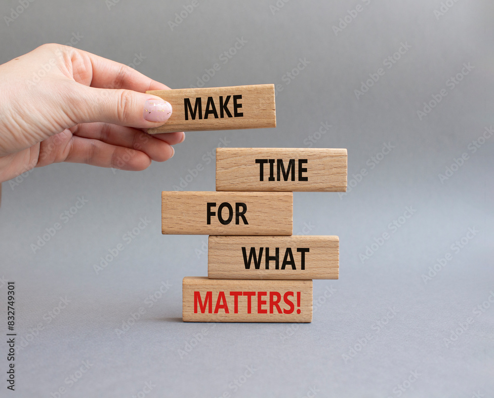 Important thing symbol. Wooden blocks with words Make time for what matters. Businessman hand. Beautiful grey background. Business and important thing concept. Copy space. Important thing symbol. Wooden blocks with words Make time for what matters. Businessman hand. Beautiful grey background. Business and important thing concept. Copy space.