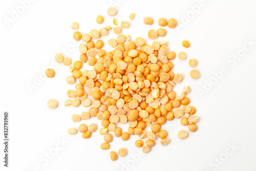 Split yellow peas pile on white background. Dry peas grains. Top view