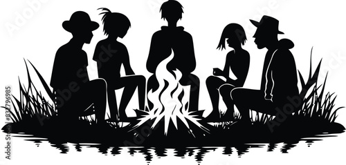 Family sit around campfire silhouette scene