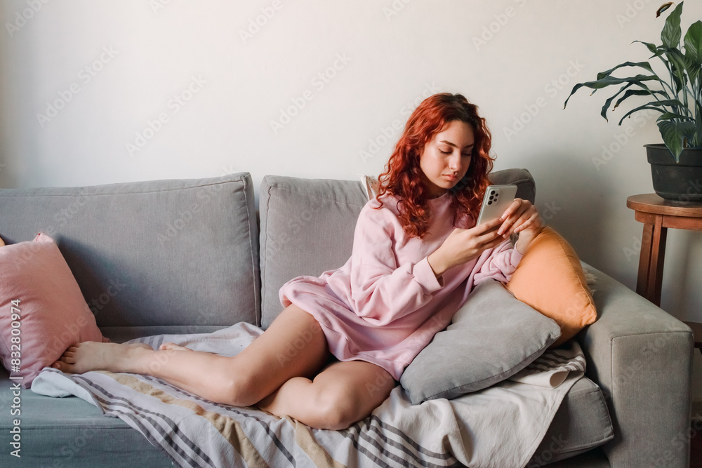 Obraz premium Young woman use smartphone in the room