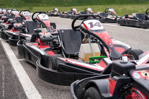 Red black go-karts on the side of a track © ZenitX