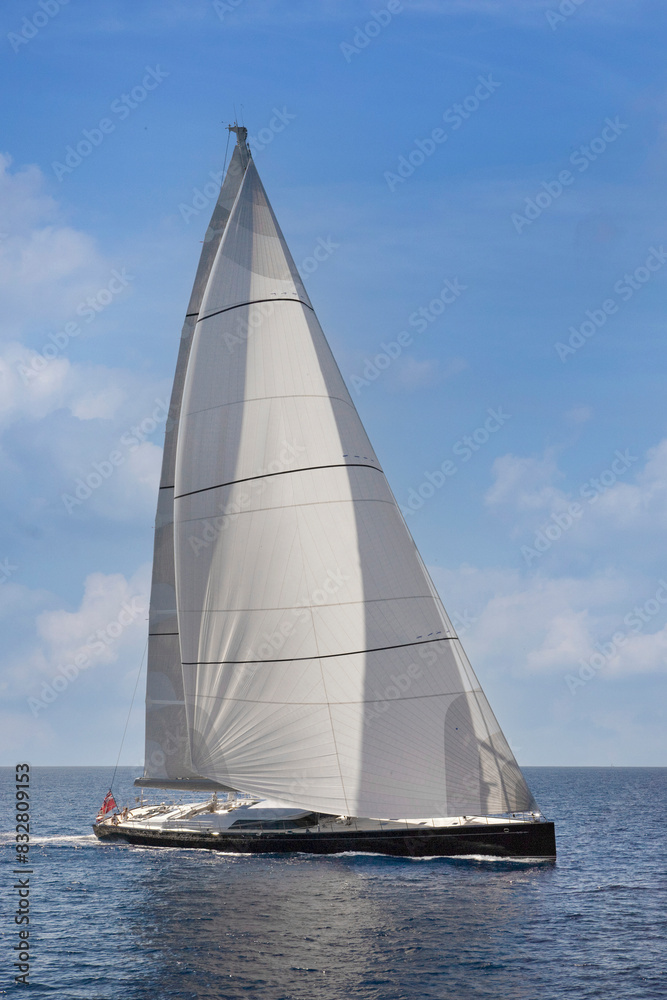 Sailing yacht at Mediterranean Sea. Sail. Boat. Helicopter view. Aerial. Palma de Mallorca. Super sailing yacht. Full sail. Sailing yacht at Mediterranean Sea. Sail. Boat. Helicopter view. Aerial. Palma de Mallorca. Super sailing yacht. Full sail.