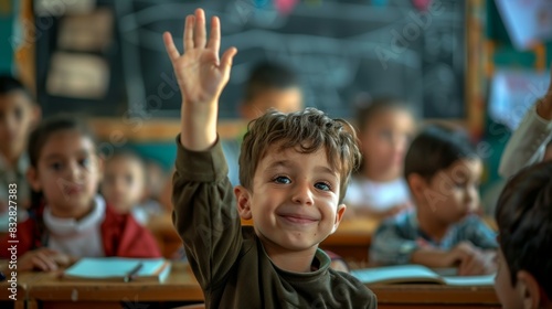 Children raise their hands to answer in the classroom. Back To School concept. Backdrop with selective focus
