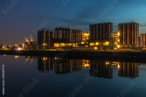Industrial night - refinery plant reflection on water