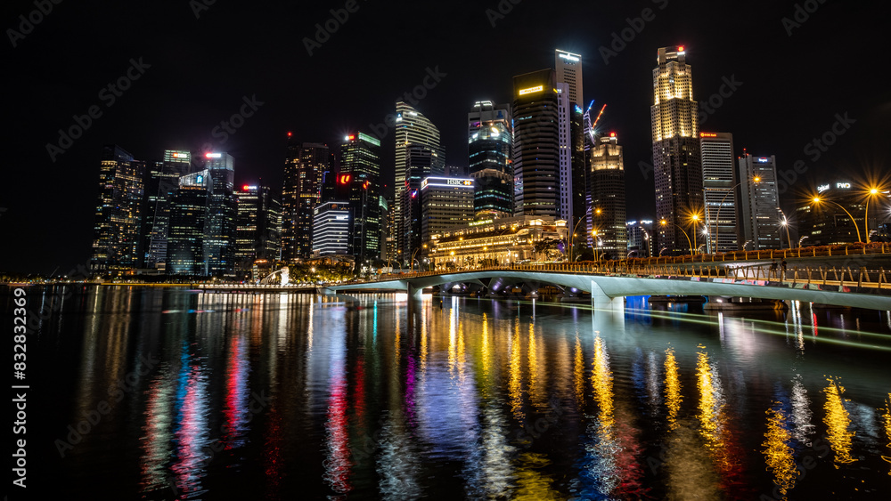 Singapore skyline at night with vibrant reflections