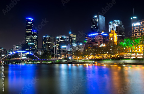 Melbourne skyline at night along yarra river photo