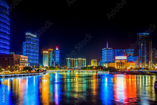 Vibrant city nightscape with illuminated skyscrapers © Bryan