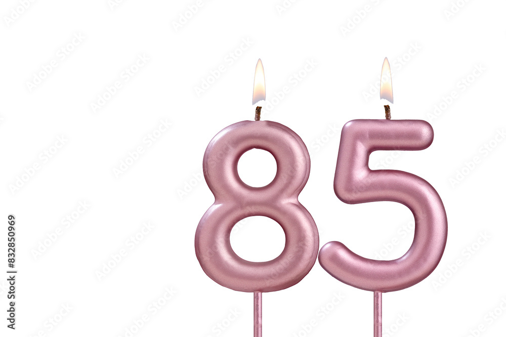 Lit birthday candle - Candle number 85 on white background Lit birthday candle - Candle number 85 on white background