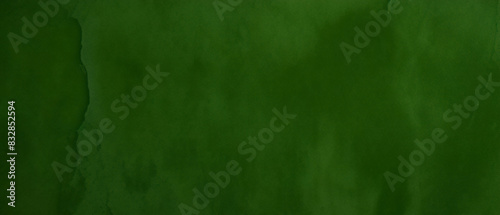 Black dark jade emerald green grunge background. Old painted concrete wall. Plaster. Close-up. Rough dirty grainy broken damaged distressed abandoned cracked. Or spooky scary horror concept. Design