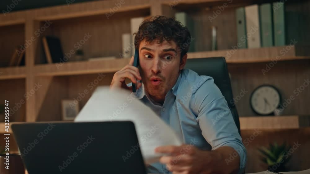 Mad executive calling smartphone holding documents at night workplace close up.