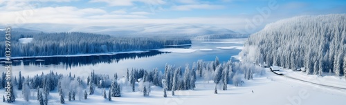 Snowcovered winter landscape with an aerial view of a frozen lake and surrounding snowy scenery
