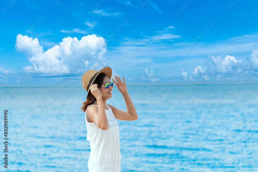 Cheerful asian woman barefoot walking on tropical summer beach. Woman walking along wave of sea water and sand on the beach. Enjoyment barefoot walk outdoor with freedom. Relaxation Travel Concept. Cheerful asian woman barefoot walking on tropical summer beach. Woman walking along wave of sea water and sand on the beach. Enjoyment barefoot walk outdoor with freedom. Relaxation Travel Concept.