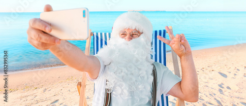 Santa Claus taking selfie a...