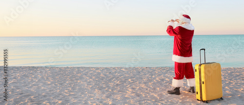 Santa Claus with luggage at...