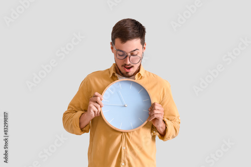 Stressed young man with clo...