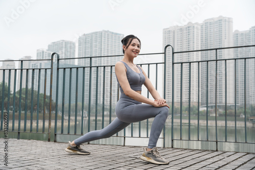 Portrait of Asian girl exercising at the park © 1112000