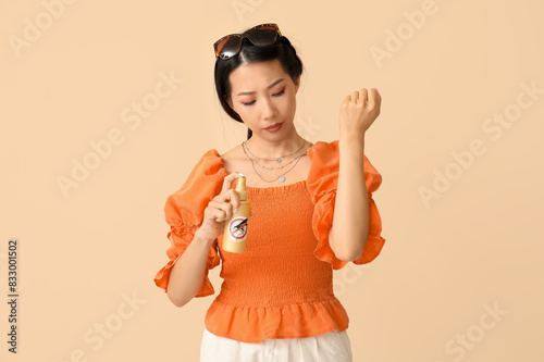 Young Asian woman with mosq...