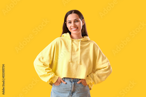 Young woman in hoodie on ye...
