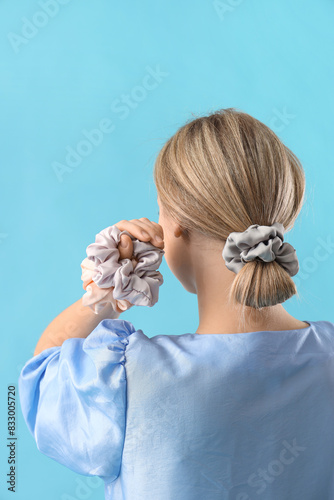 Young blonde woman with scr...