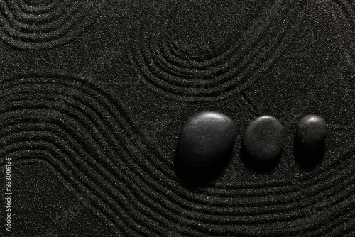 Photography Stones on dark sand with lines in Japanese rock garden