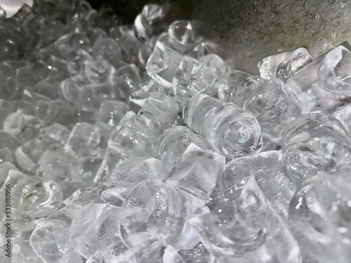 A pile of ice as clear as crystal. Inside the ice making cabinet