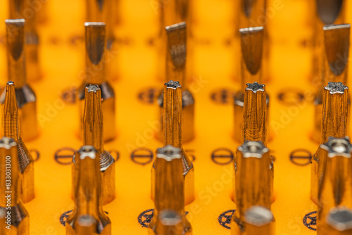 close up view of multiple size and type of precision screwdriver bits. Selective focus. photo