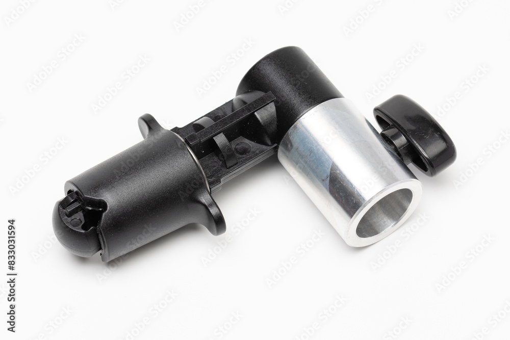 Angle view of light stand clip for collapsible backdrop, also known as reflector holder. Isolated in white background. Selective focus. Angle view of light stand clip for collapsible backdrop, also known as reflector holder. Isolated in white background. Selective focus.
