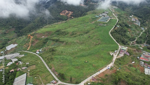 Kundasang, Malaysia - May 28 2024: Aerial View of The Desa Dairy Cattle Farm photo