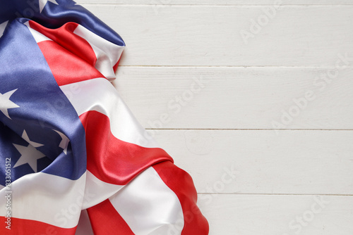 Flag of USA on light wooden...