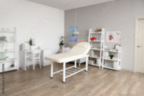 Blurred view of medical office with couch  doctor s workplace and sofa