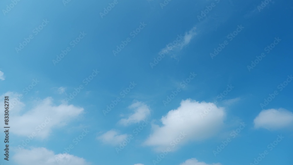 A bright blue sky scattered with fluffy white clouds. The serene, clear sky and soft clouds create a peaceful and calming atmosphere, indicative of a beautiful day. Wonder of nature background.
A bright blue sky scattered with fluffy white clouds. The serene, clear sky and soft clouds create a peaceful and calming atmosphere, indicative of a beautiful day. Wonder of nature background.