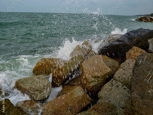 Photos of Close up of the sea waves crashing on the rocks.