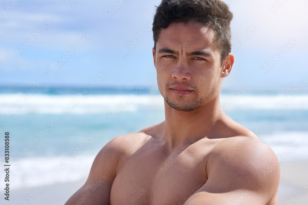 Summer, portrait and man on beach with confidence for surfing or recreation activity or wellness. Outdoor, athlete and shirtless person for bodybuilding, training or fitness on Australia coastline Summer, portrait and man on beach with confidence for surfing or recreation activity or wellness. Outdoor, athlete and shirtless person for bodybuilding, training or fitness on Australia coastline
