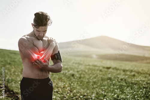 Fitness, man and shoulder pain in nature, accident or muscle tension of workout session. Ache, male runner and crisis or red glow with inflammation, fibromyalgia and tendinitis after injury outdoor photo